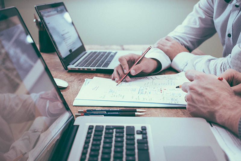 Right-Time-Sell-Business Right Time to Sell a Business. Person holding pencil near laptop Photo by Helloquence on Unsplash.